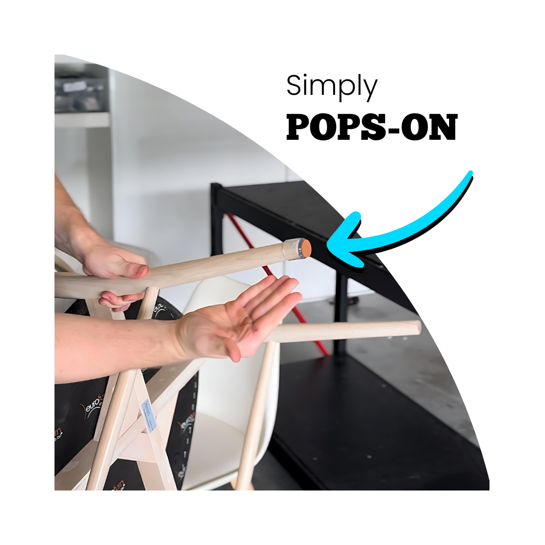 Hands fitting a chair leg cap to a chair turned upside down